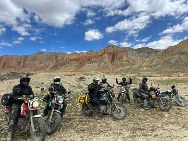 Group of riders on a motorbike tour through Upper Mustang, Nepal