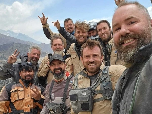 Group of motorcycle riders taking a selfie during an Upper Mustang motorbike tour in Nepal