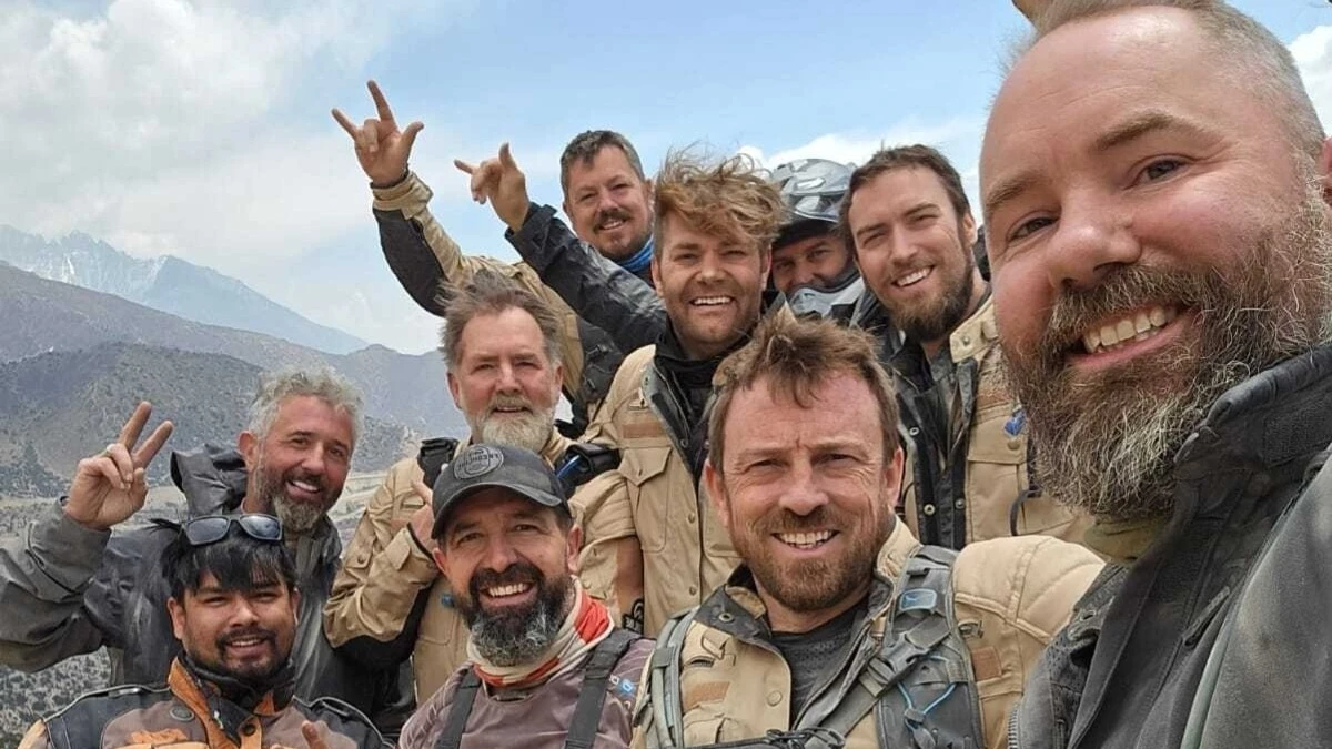 Group of motorcycle riders taking a selfie during an Upper Mustang motorbike tour in Nepal