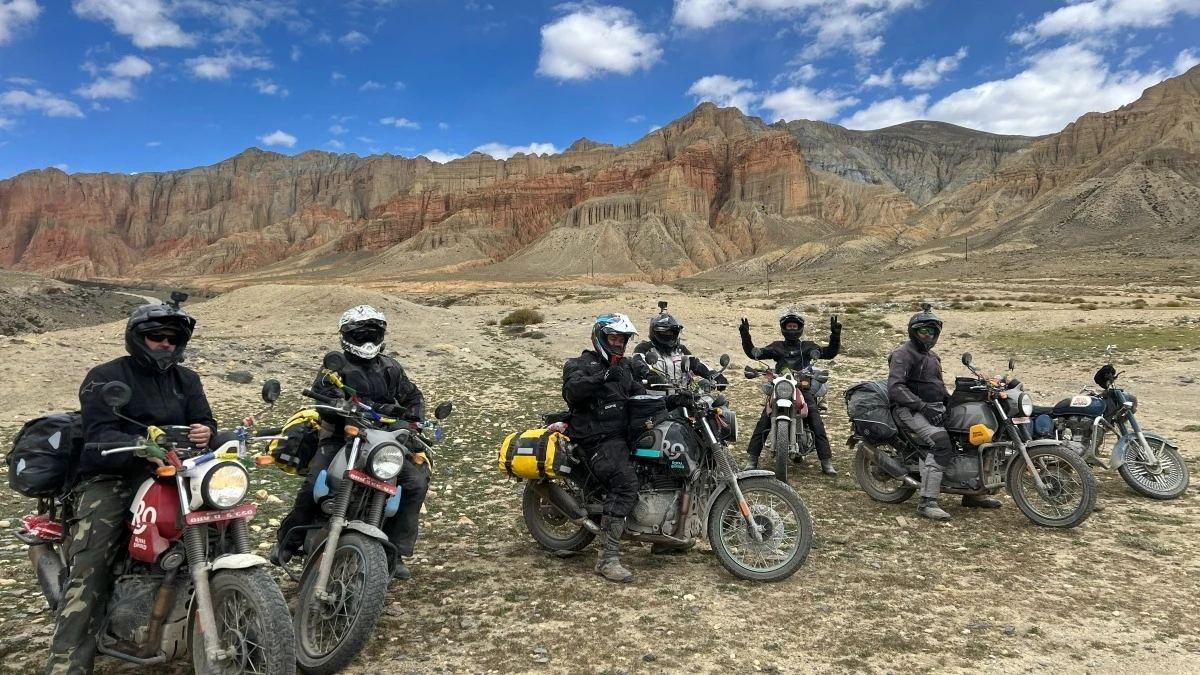 Group of riders on a motorbike tour through Upper Mustang, Nepal